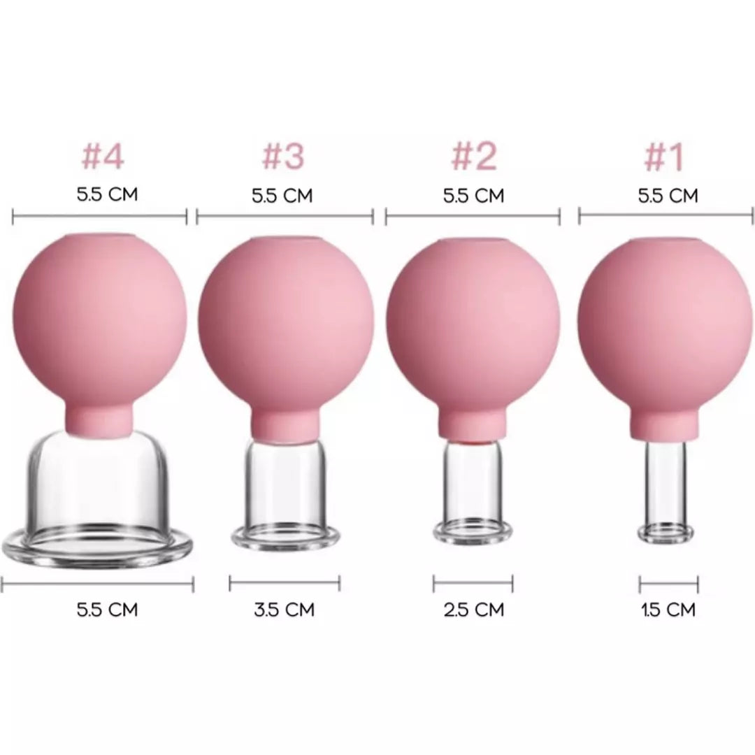 De Facial Cupping Set in de kleur roze. Facial cupping stimuleert de gezondheid van je huid en vermindert fijne lijntjes en rimpels. De verschillende afmetingen van de facial cupping set staan naast elkaar weergegeven. 