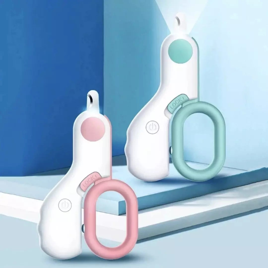De blauwe en roze nagelknippers voor huisdieren met ingebouwd LED licht zijn te zien.