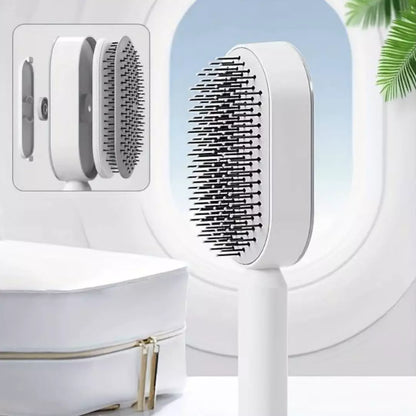 De witte ZenTangle zelfreinigende haarborstel is in lagen zichtbaar. Je ziet hoe de techniek werkt achter de borstel.  Je haarborstel schoonmaken kost vanaf nu geen enkele moeite meer.