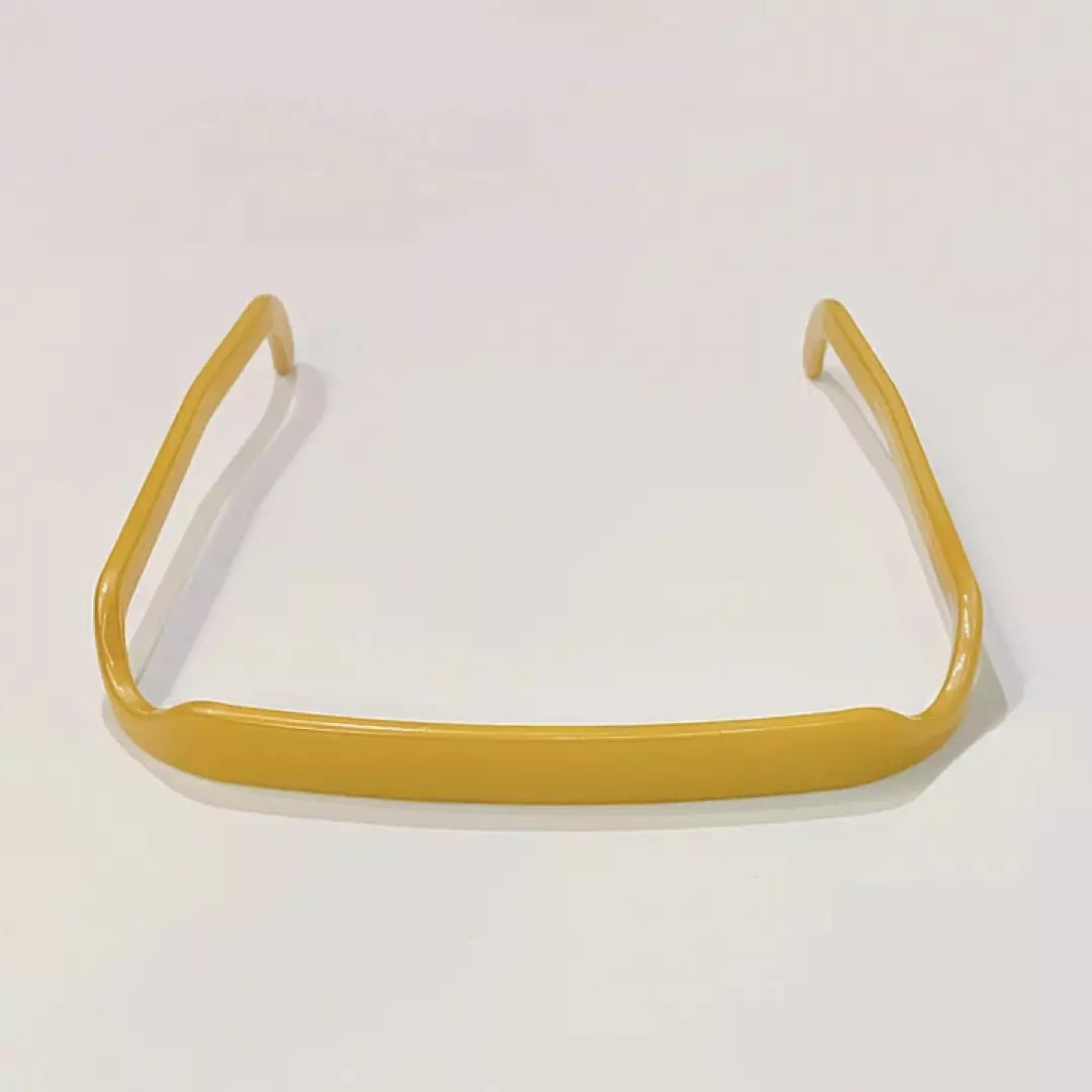 De Zonnebril Haarband in de kleur goud.
